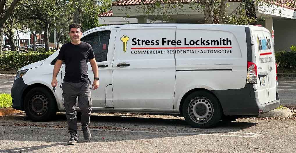 Locksmith technician repairing a deadbolt in Atlantis, FL